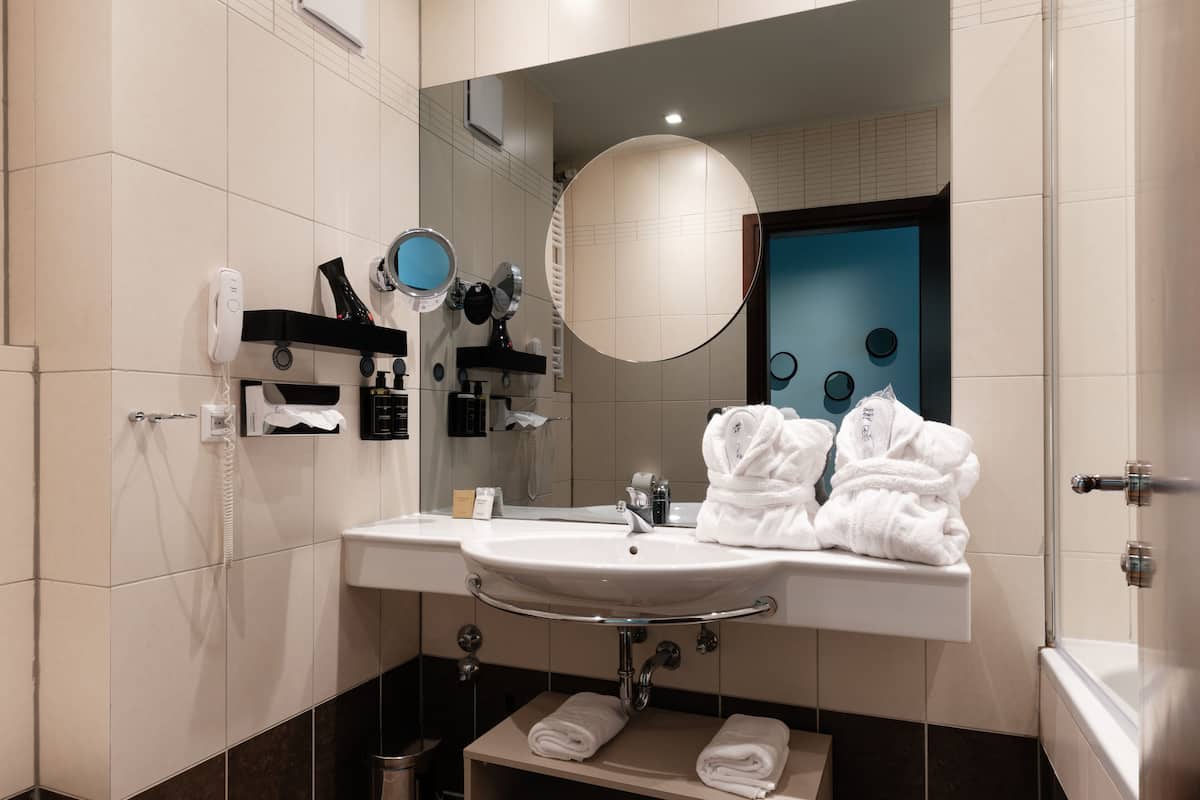 Eco-friendly toiletries, hair dryer, bathrobes, towels