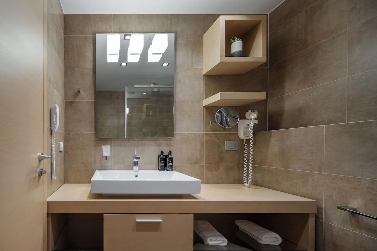 Eco-friendly toiletries, hair dryer, bathrobes, towels