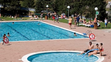 Enjoy swimming, sunbathing, and beach activities in our pool area with designated swimming and sand zones.