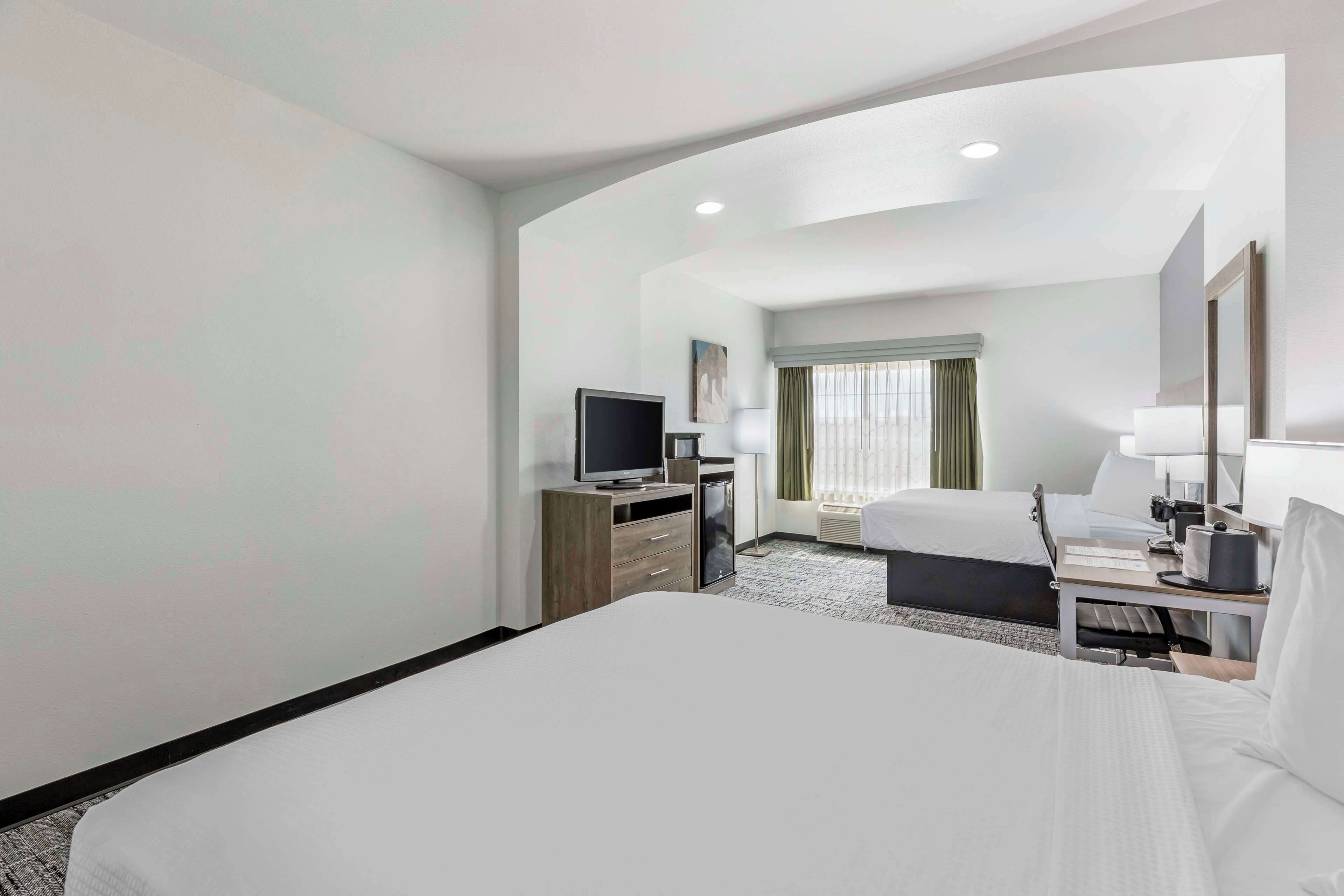 standard room, 2 queen beds, non smoking, refrigerator & microwave (larger room) | pillow-top beds, desk, laptop workspace, blackout curtains