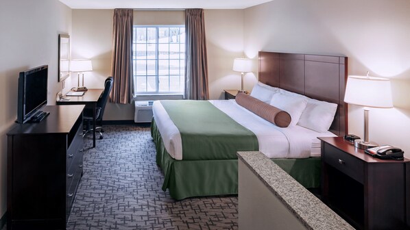 Suite, 1 King Bed, Non Smoking | Desk, laptop workspace, blackout curtains, iron/ironing board
