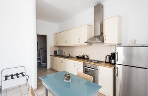 Apartment (2 people) | Private kitchen | Full-size fridge, microwave, oven, stovetop