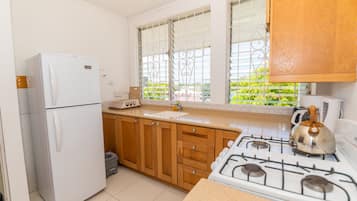 Standard Room, 2 Bedrooms | Private kitchen | Fridge, microwave, stovetop, coffee/tea maker