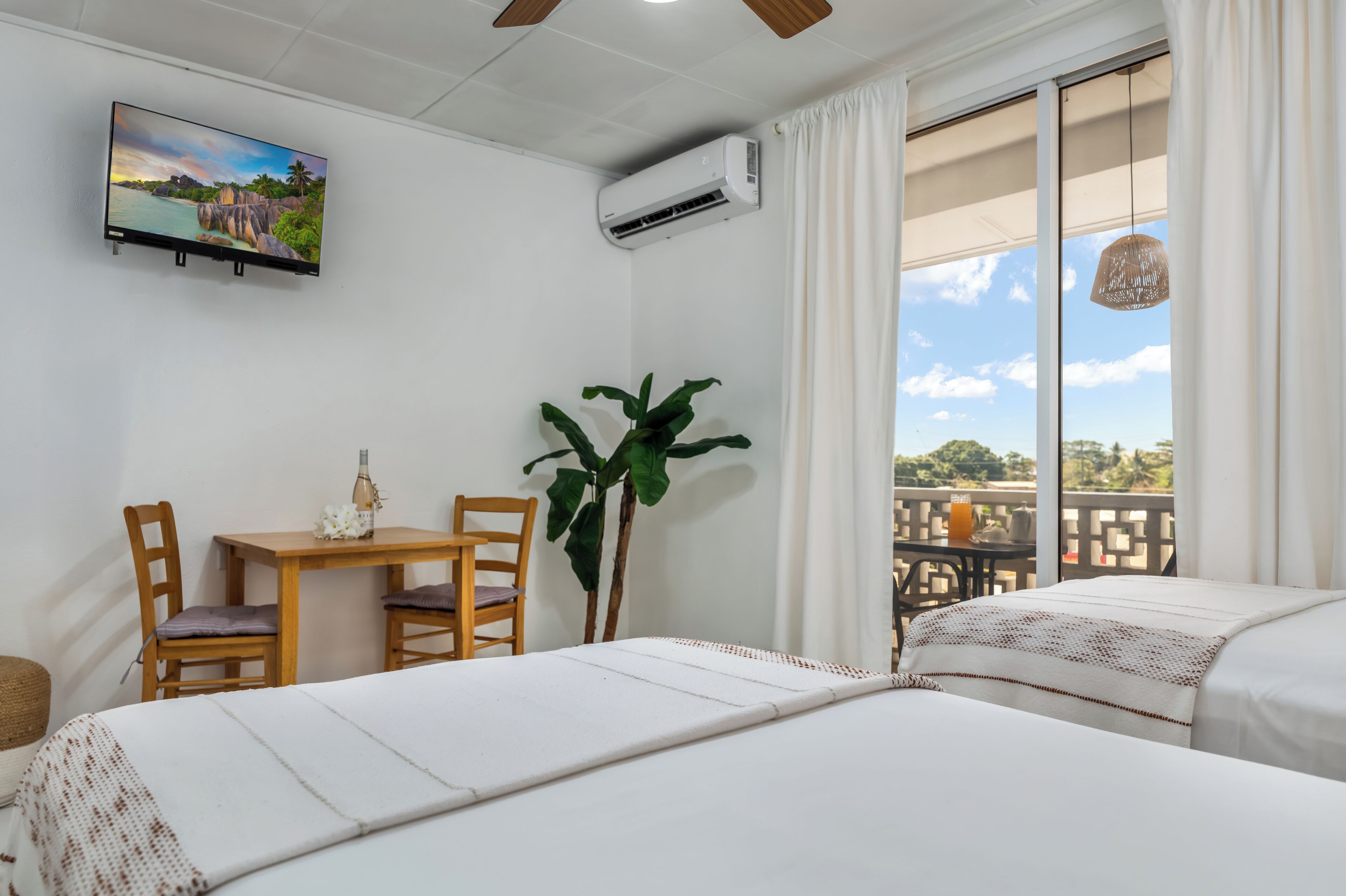 Standard Room, 2 Bedrooms | Blackout drapes, iron/ironing board, free cribs/infant beds, free WiFi