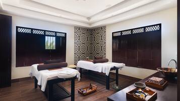 Experience serene relaxation in this spa room with two massage tables, a spacious wardrobe, and a calming atmosphere.
