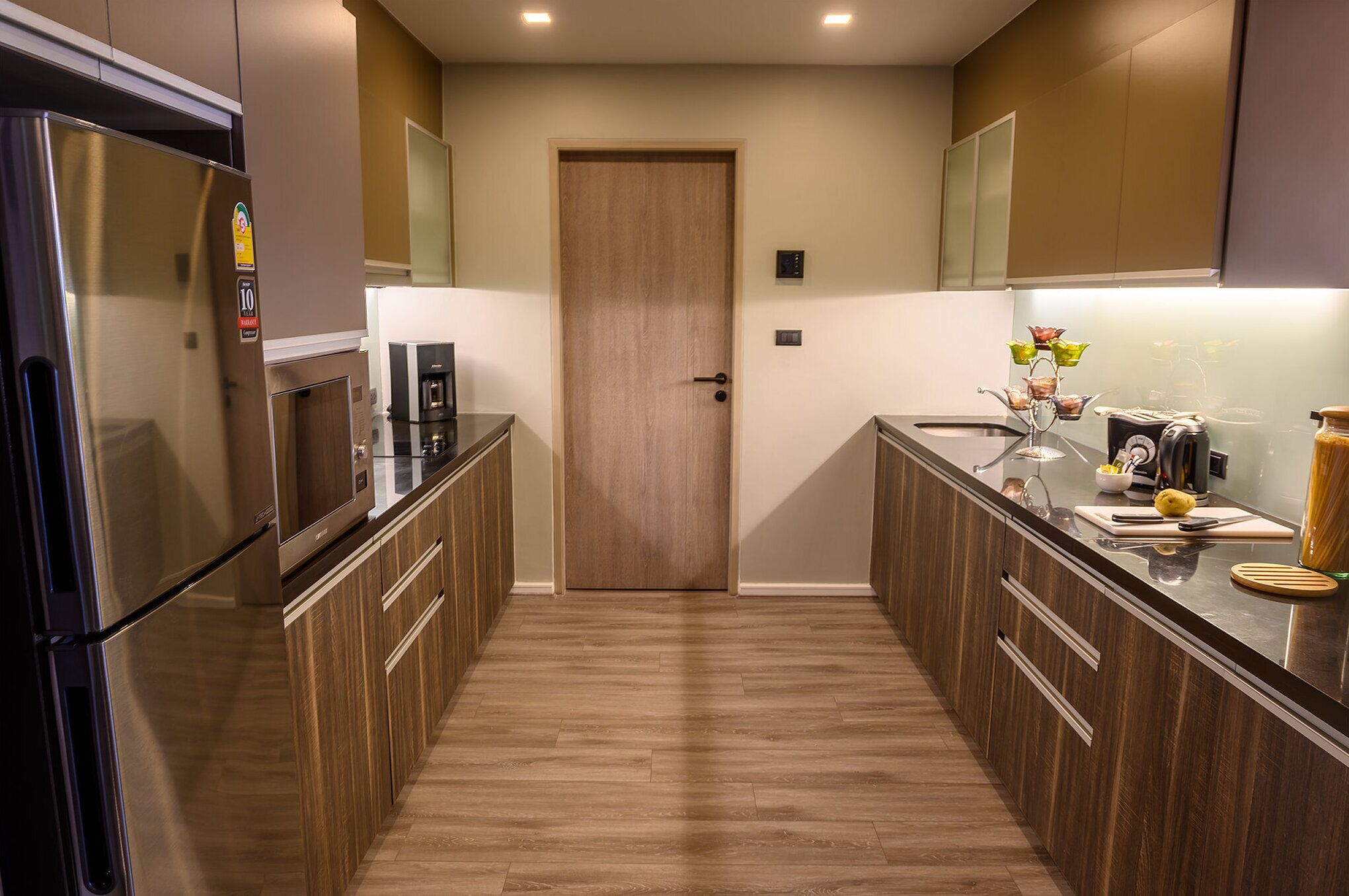 full-sized fridge, microwave, stovetop, coffee/tea maker