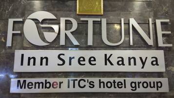A sign with the text "FORTUNE Inn Sree Kanya Member ITC's hotel group".