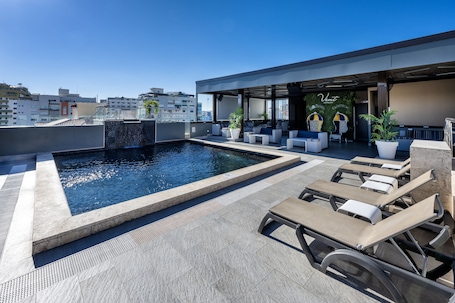 Outdoor pool, pool umbrellas, sun loungers