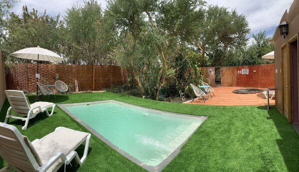 Outdoor pool, open noon to 11:00 PM, pool umbrellas, pool loungers