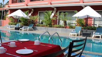 Breakfast, lunch served; local and international cuisine, pool views