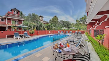 2 outdoor pools, open 7:00 AM to 7:00 PM, pool umbrellas, pool loungers