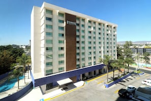 A multi-story hotel with a prominent sign reading 'Staybridge Suites.'