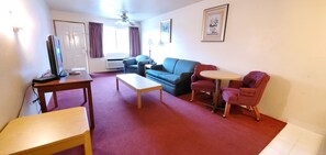 Executive Kitchenette Suite, 1 King Bed, 2 Queen Bed with Sofa Bed, Non Smoking | 1 bedroom, desk, laptop workspace, iron/ironing board