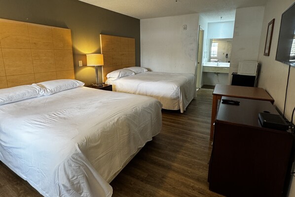 Suite, 2 Queen Beds | Desk, iron/ironing board, free WiFi, bed sheets