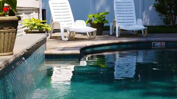 Outdoor pool, open 9:00 AM to 9:00 PM, pool loungers