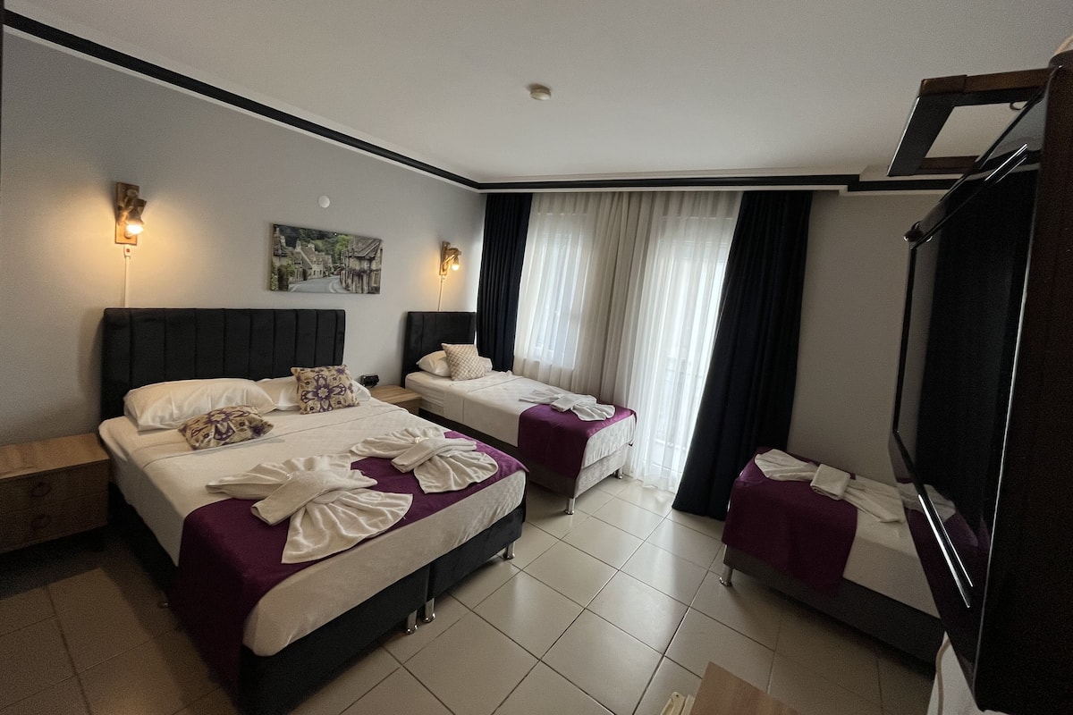 Family Quadruple Room | Premium bedding, pillow-top beds, minibar, in-room safe