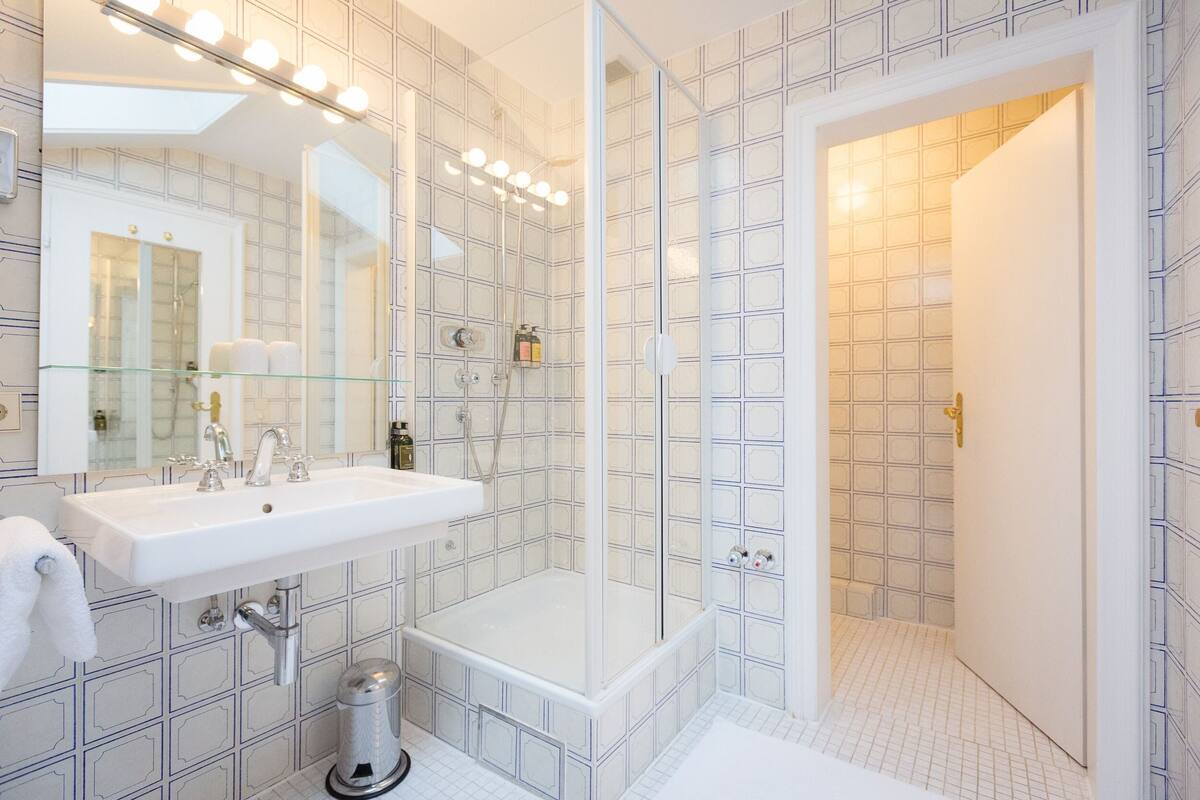 designer toiletries, hair dryer, towels