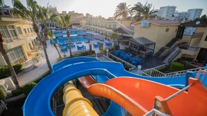 A water park with multiple slides and a pool area. - Sand Beach Resort (Hurghada)