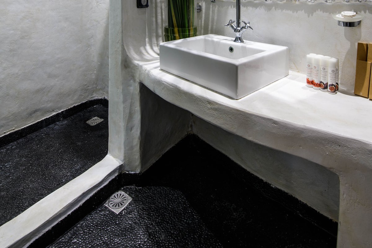one bedroom suite with sea view | bathroom | shower, rainfall showerhead, free toiletries, hair dryer