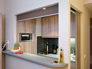 Full-sized fridge, microwave, stovetop, dishwasher