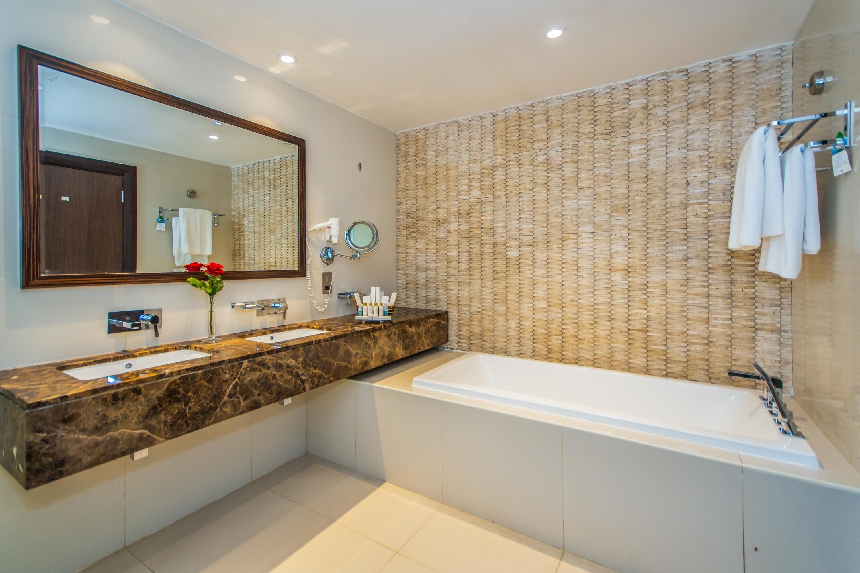 combined shower/bathtub, deep-soaking bathtub, hair dryer, bathrobes