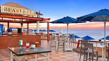 6 bars/lounges, poolside bar, beach bar