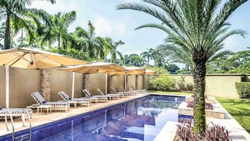 Outdoor pool, pool umbrellas, sun loungers