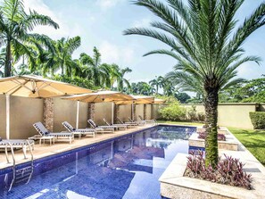 Outdoor pool, pool umbrellas, sun loungers