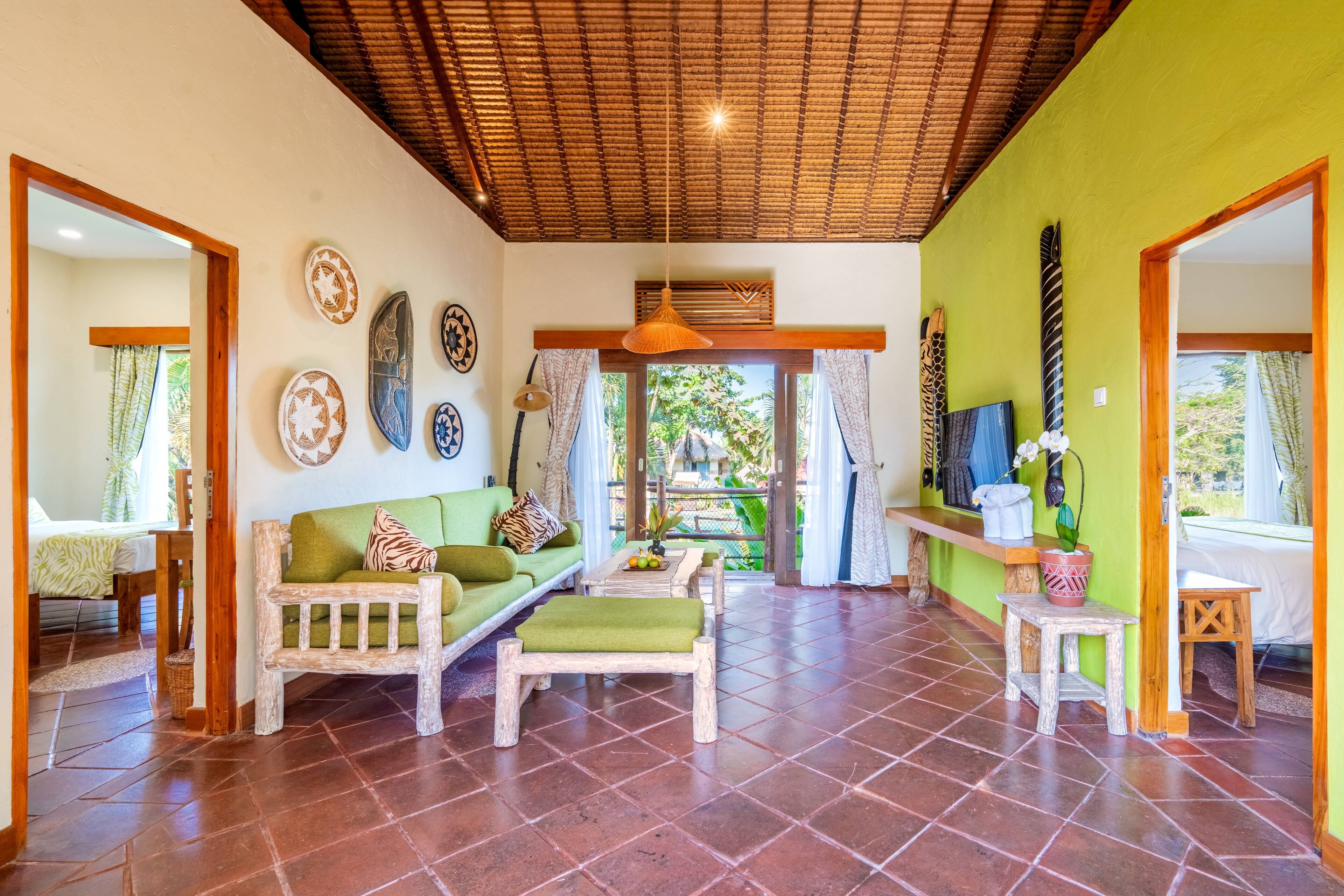 kifaru family suite + bali safari entrance & safari journey | living area | lcd tv