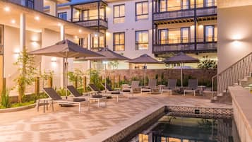 Outdoor pool, pool umbrellas, sun loungers