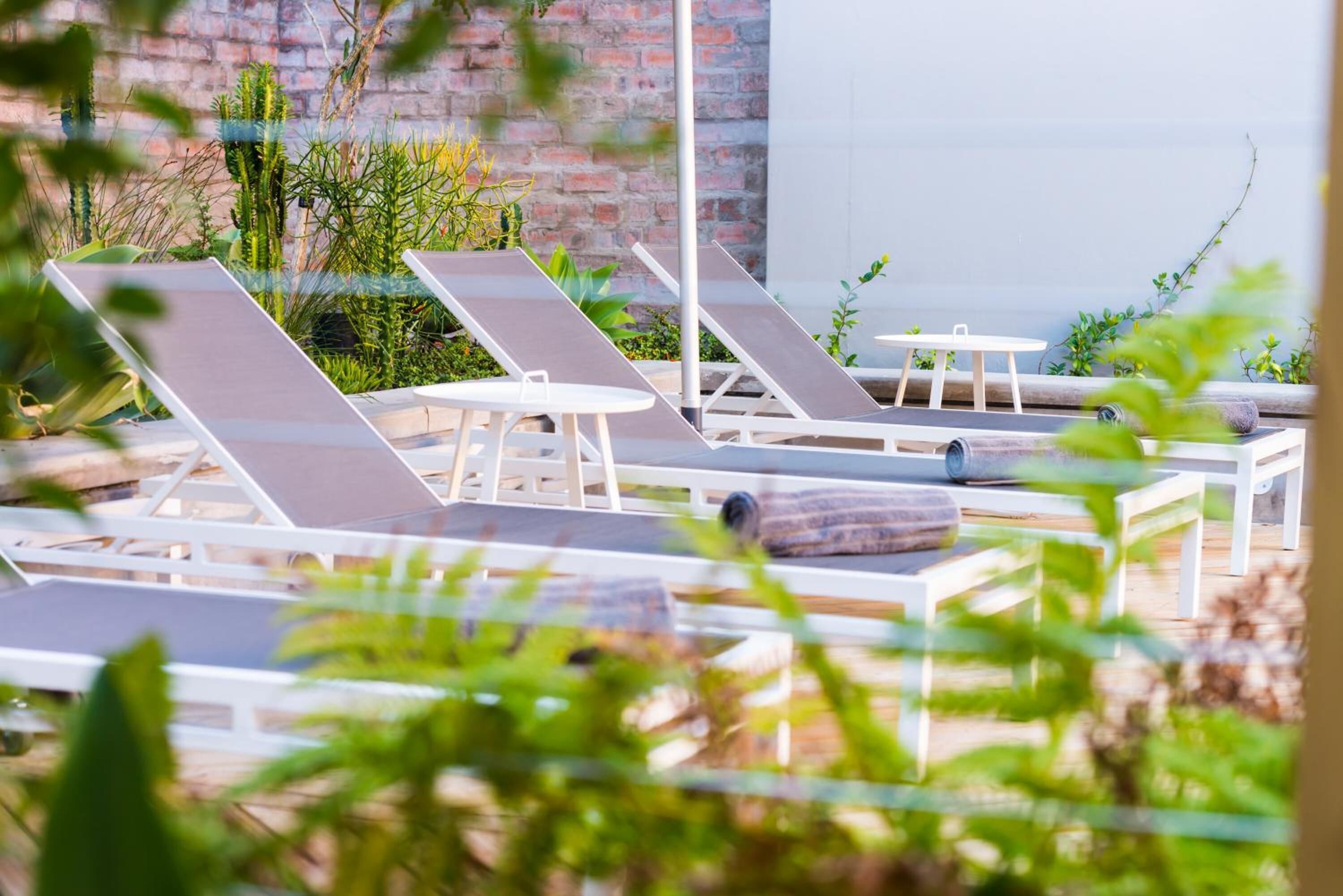 outdoor pool, pool umbrellas, pool loungers