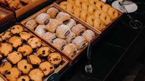 A variety of baked goods displayed in wooden boxes, including pastries and cookies. - Axis Porto Business & Spa Hotel (Matosinhos)