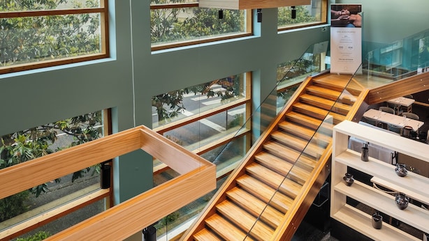 A multi-level interior with glass railings, wooden beams, and a staircase. - Axis Porto Business & Spa Hotel (Matosinhos)
