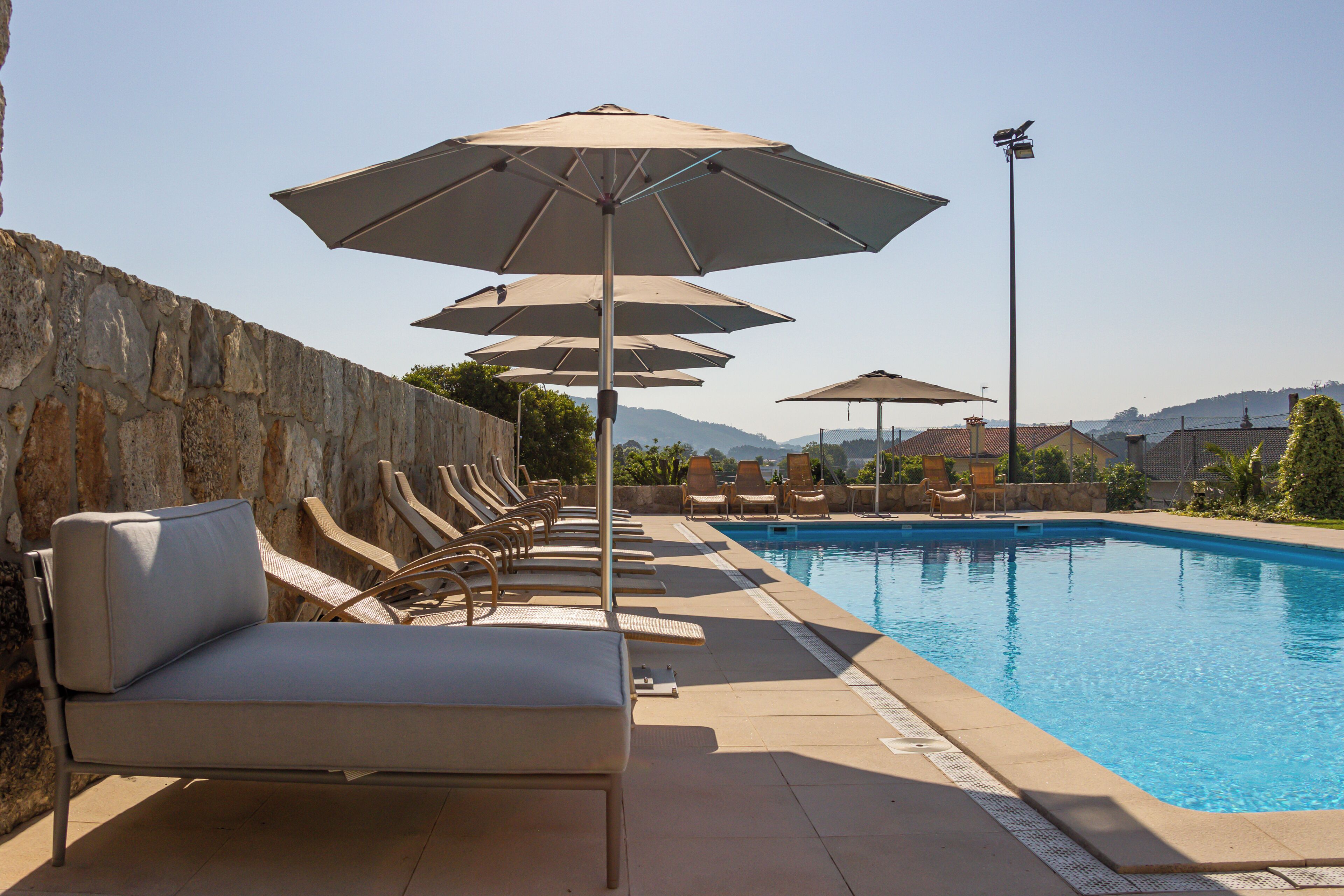 outdoor pool, open 8:30 am to 10 pm, pool loungers