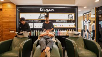 Experience expert hair transformations at Kérastase Paris, offering FUSIO and SCALP EXPERTS services in a clean and modern setting.