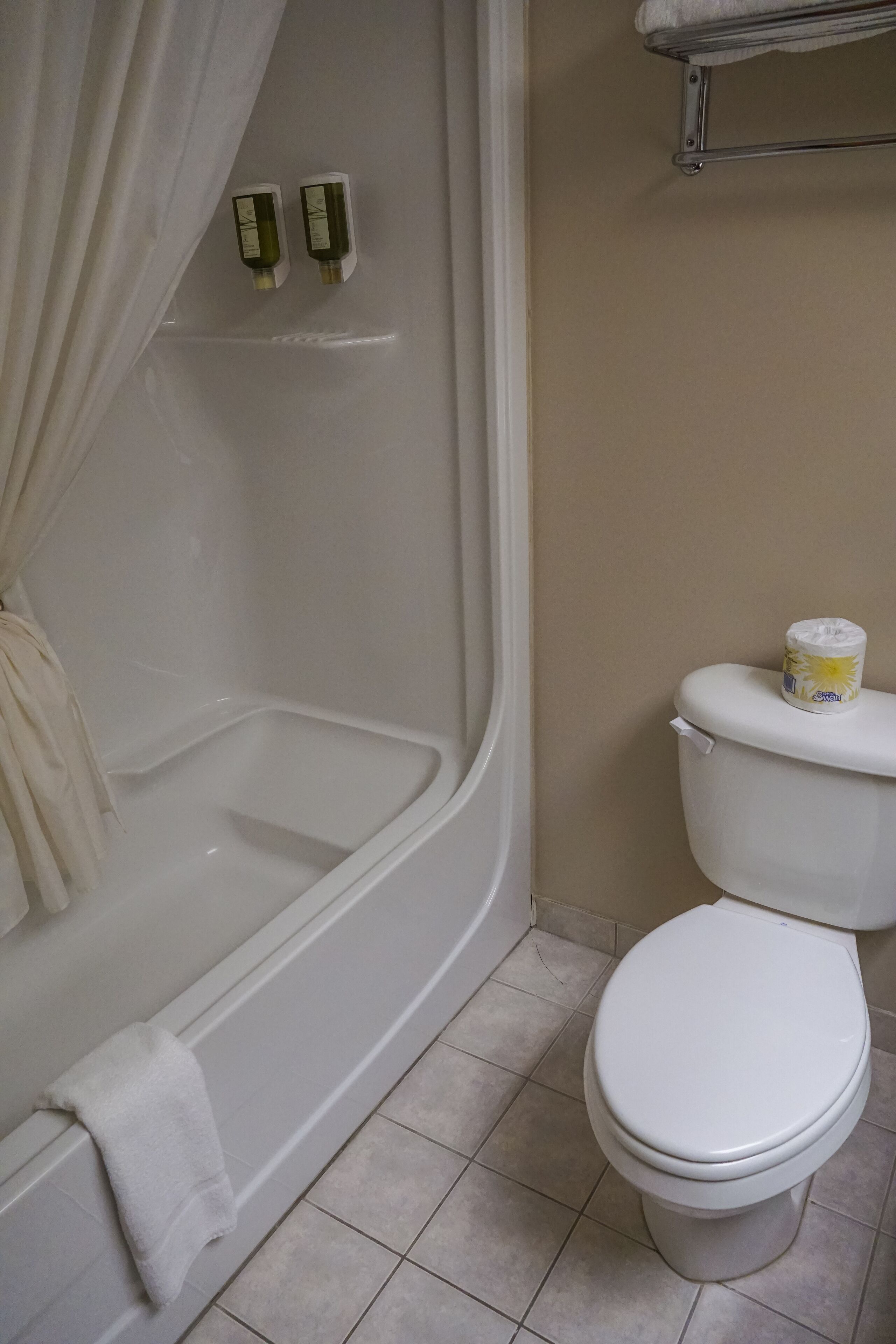 comfort room | bathroom | combined shower/bathtub, hair dryer, towels