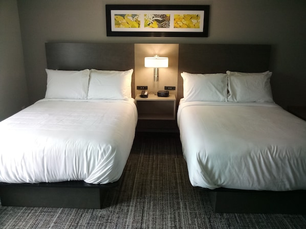 Pillowtop beds, desk, blackout drapes, iron/ironing board