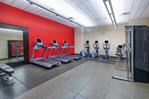 A gym with treadmills, elliptical machines, and a mirrored wall. - Embassy Suites by Hilton Houston Energy Corridor (Houston)
