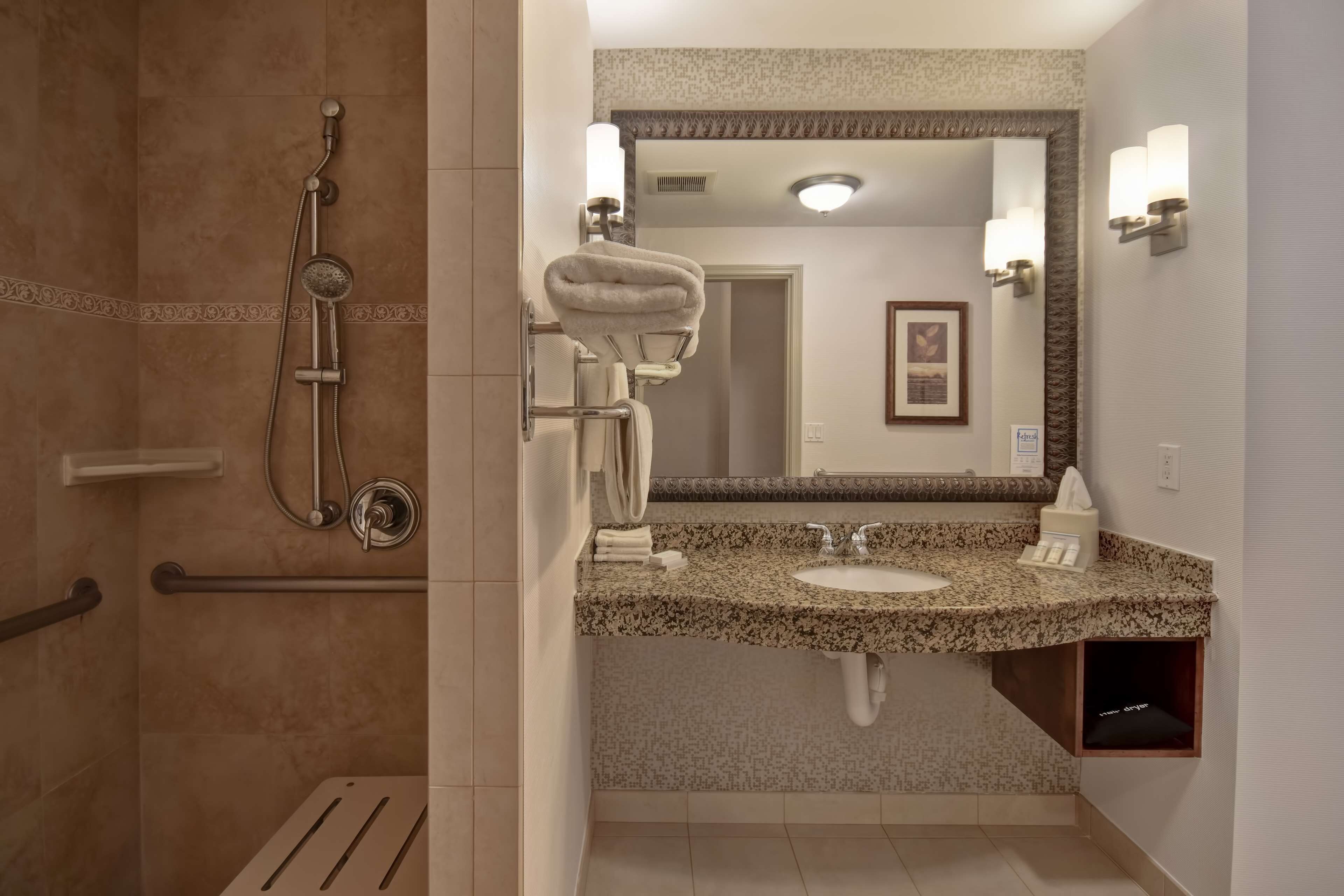 bathtub, free toiletries, hair dryer, towels