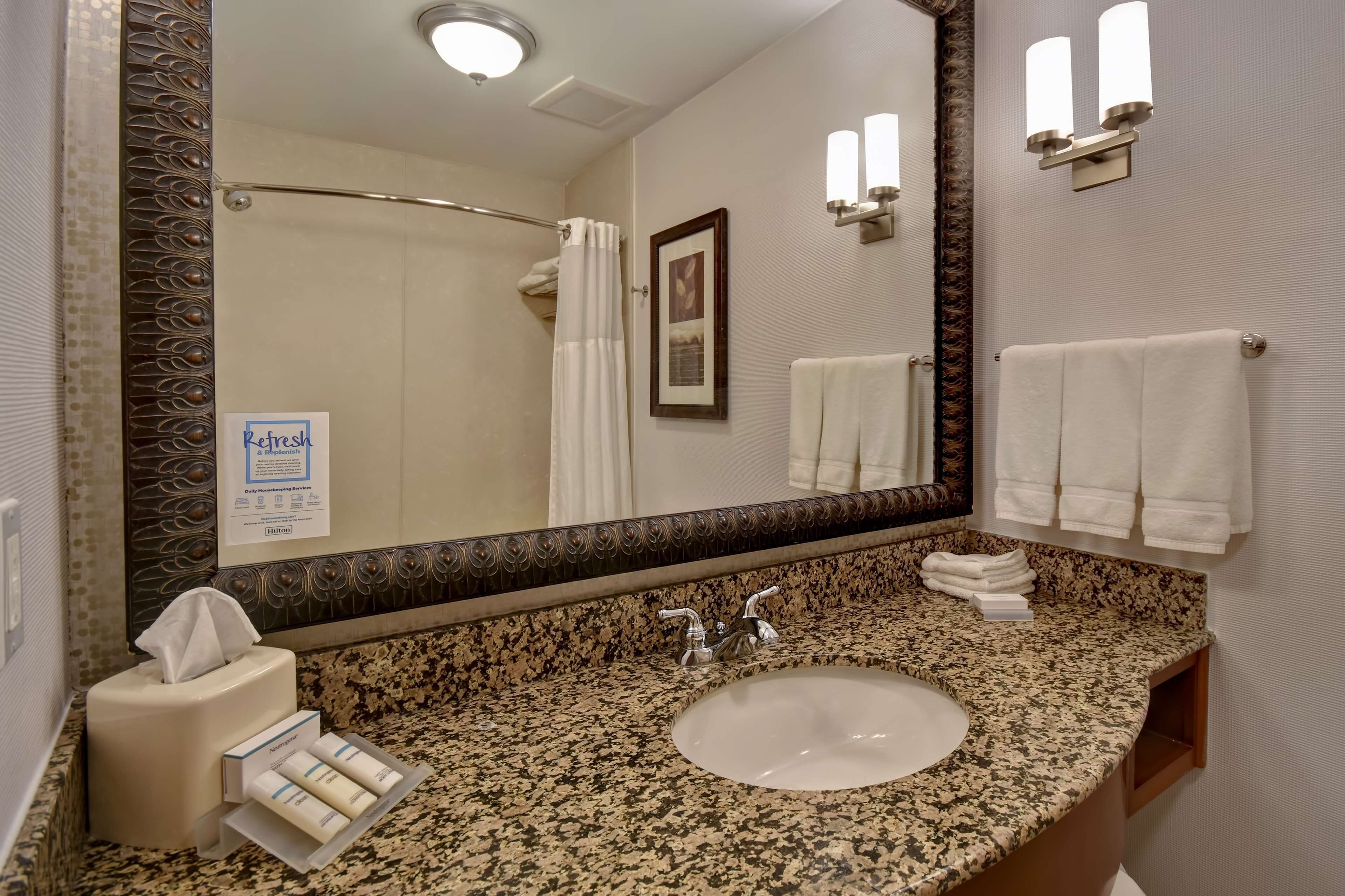 bathtub, free toiletries, hair dryer, towels