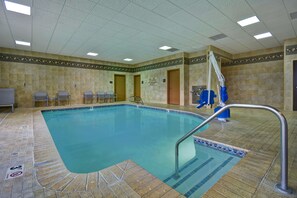 Relax by the rectangular pool surrounded by a tiled deck and enjoy the soothing atmosphere.