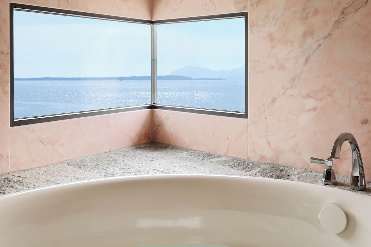 le cap suite | bathroom | rainfall showerhead, designer toiletries, hair dryer, bathrobes