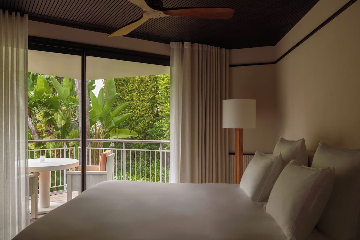 Deluxe Room with Garden View | Minibar, in-room safe, individually decorated, desk