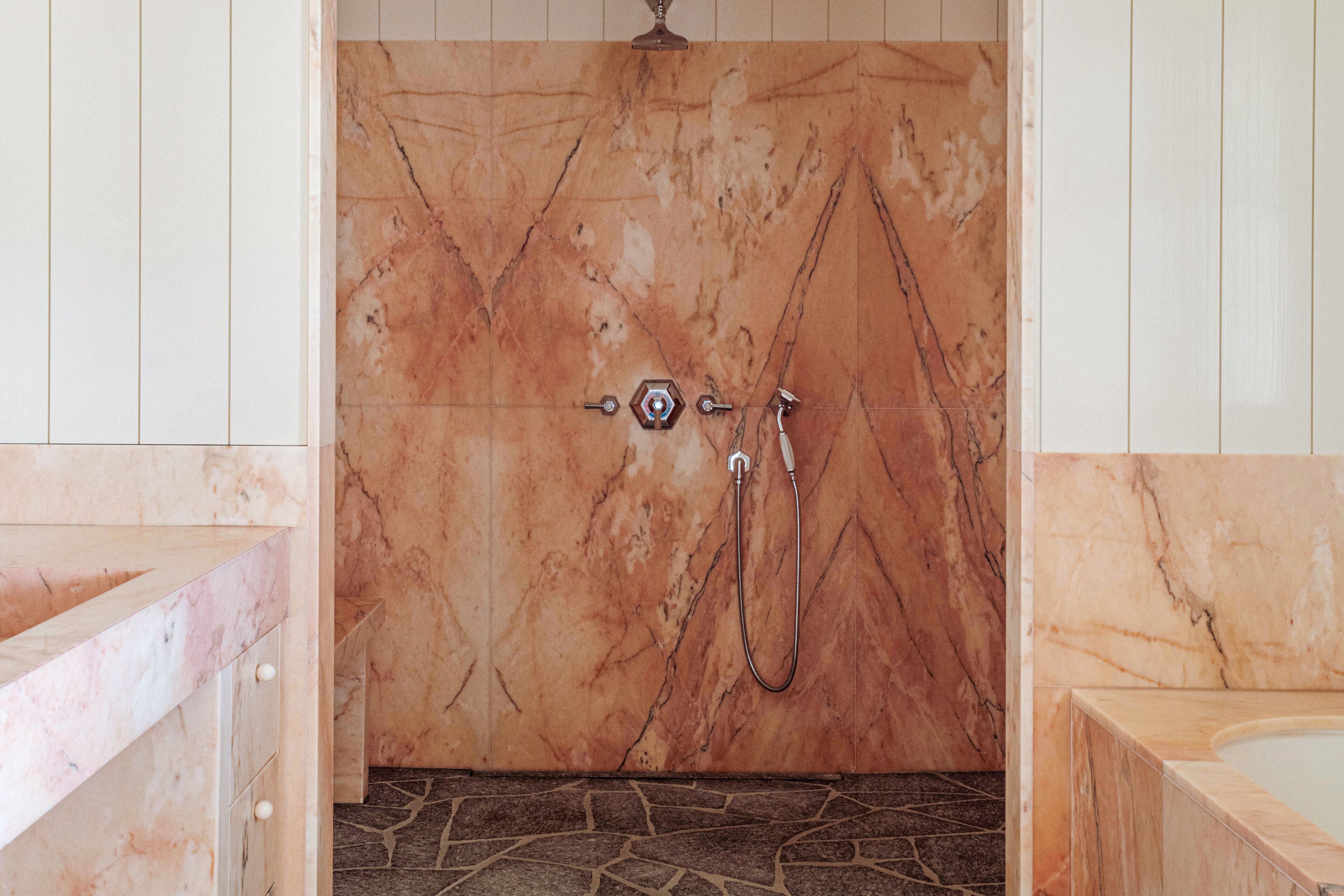 basic suite | bathroom | rainfall showerhead, designer toiletries, hair dryer, bathrobes