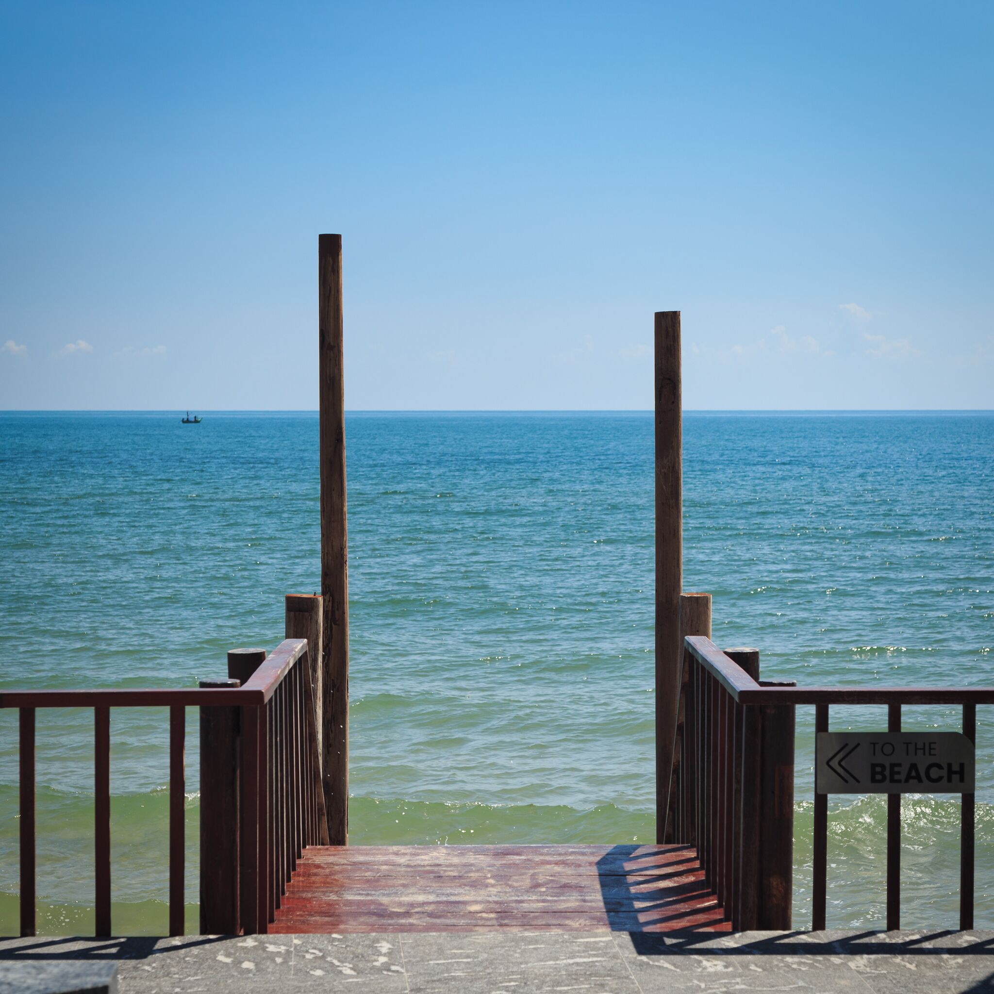 private beach, white sand, beach umbrellas, beach towels