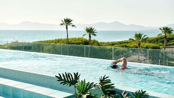 Indoor pool, pool umbrellas, pool loungers