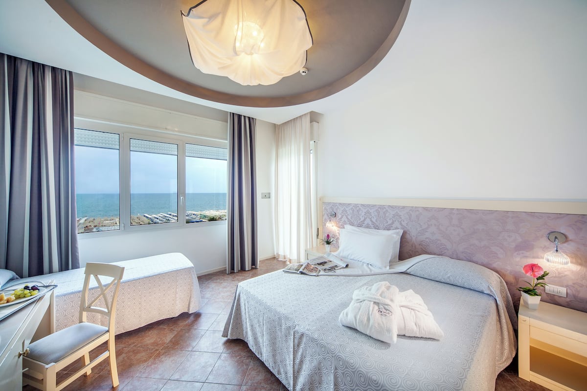 Superior Triple Room | Minibar, in-room safe, desk, soundproofing