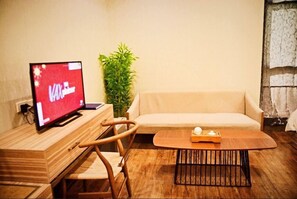 32-inch flat-screen TV with cable channels, TV, iPod dock