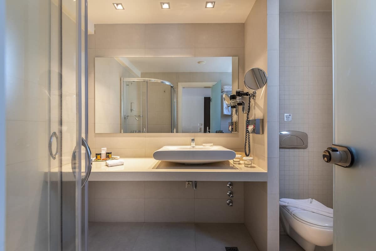 maisonette suite sea front with sharing pool | bathroom | designer toiletries, hair dryer, bathrobes, slippers