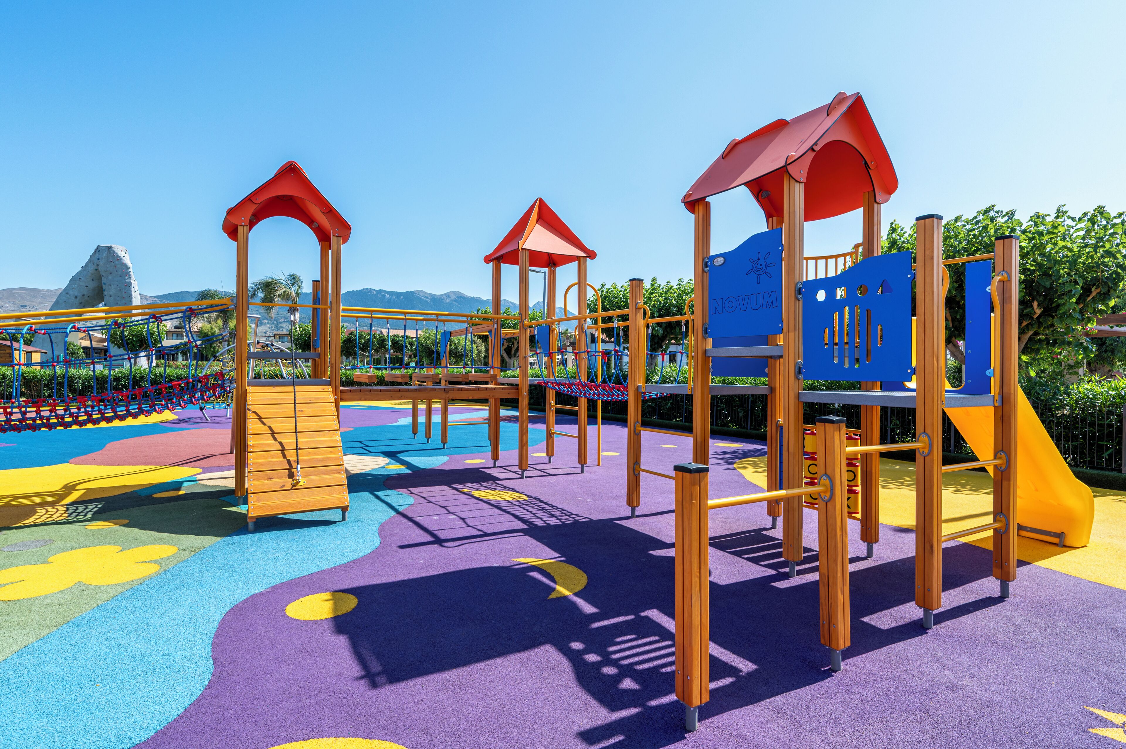 A playground with climbing structures and slides.